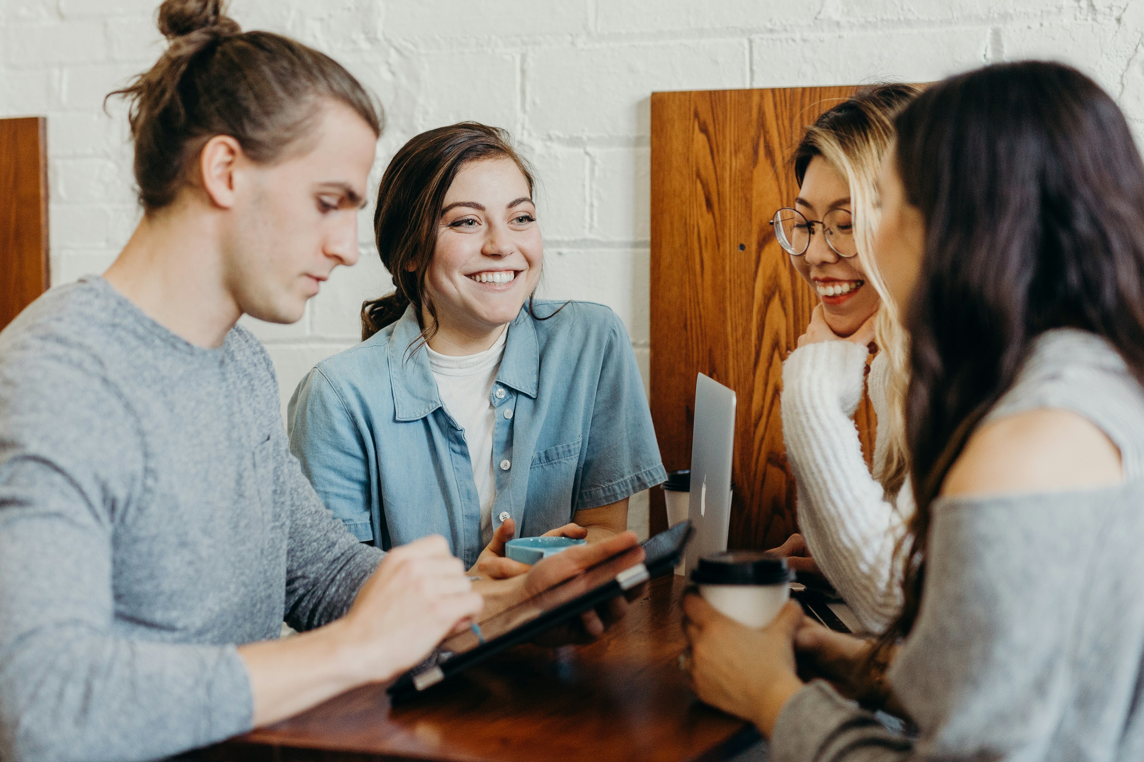 Friends gathered around a table in conversation